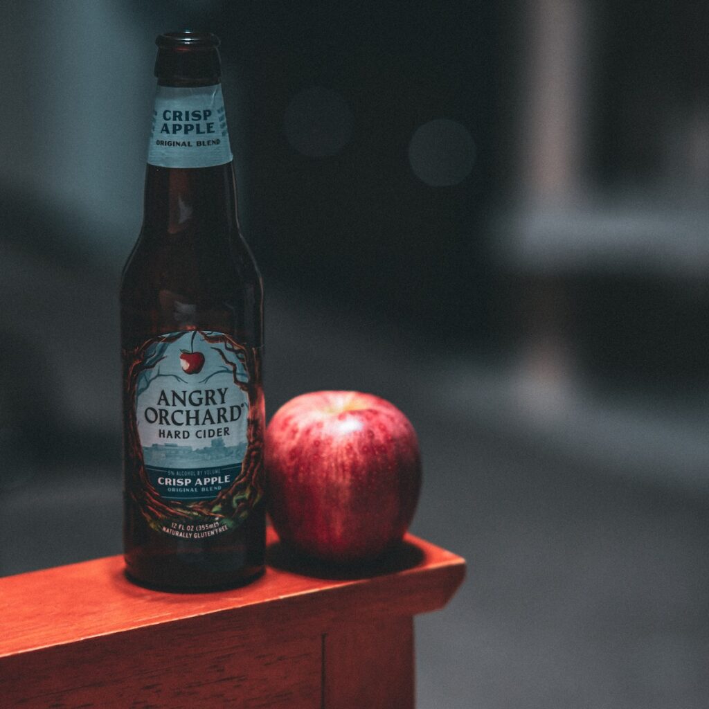 Apple Cider Bottle with Apple - Angry Orchard Hard Cider Bottle Beside Red Apple Fruit